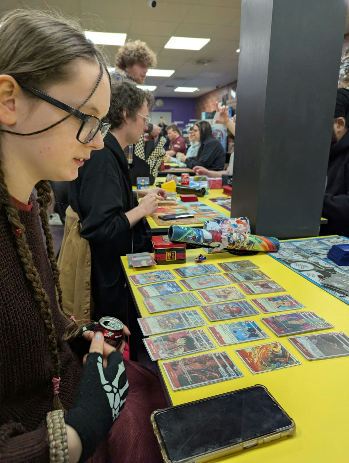 Customer playing one piece card game at Geek Retreat